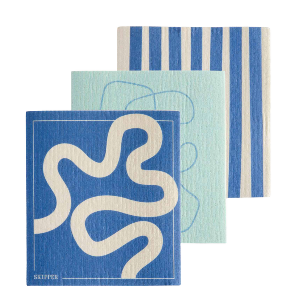Set of three patterned dish cloths with blue and white designs on a white background
